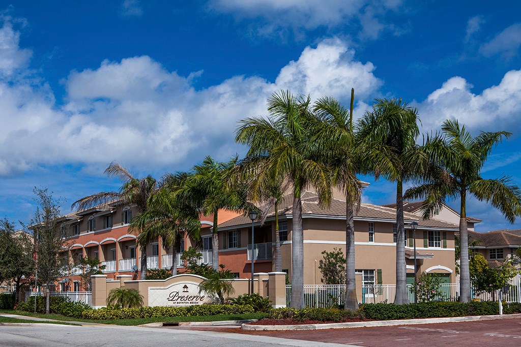 Preserve at Boynton Beach community exterior with palm trees