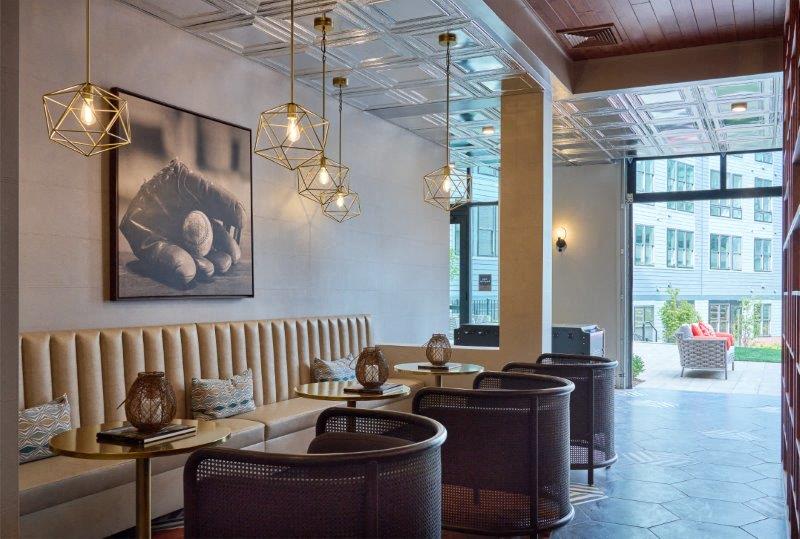the lobby of a restaurant with tables and chairs