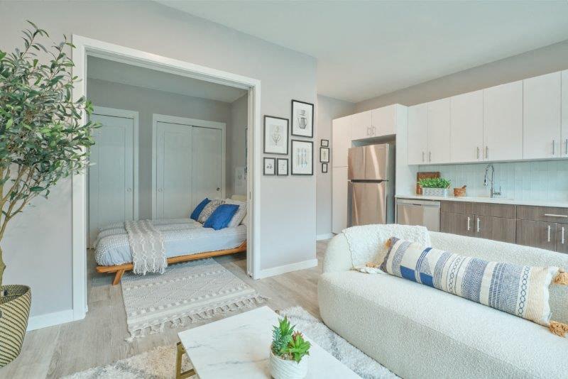 a living room with a couch and a bed