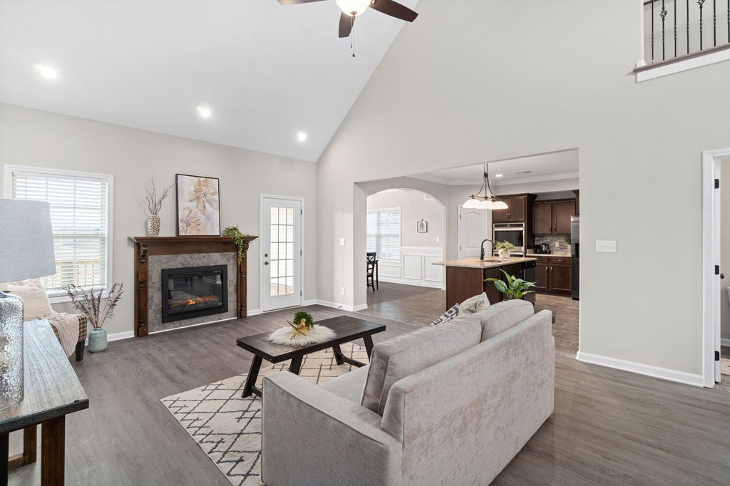 a living room with couches and a fireplace