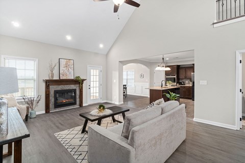 a living room with couches and a fireplace