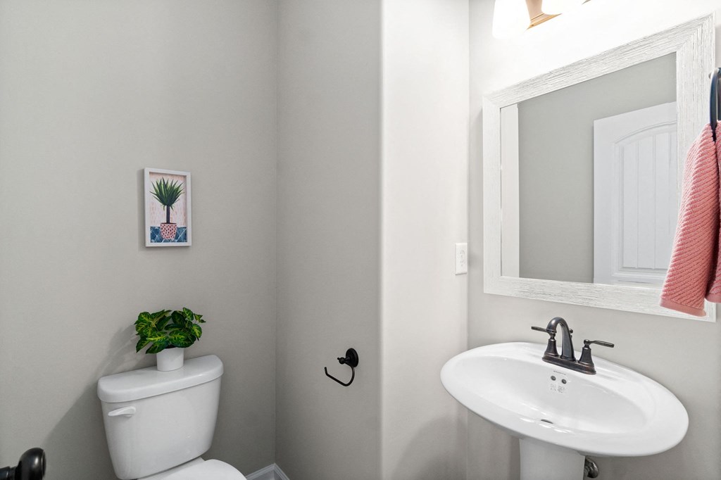 a small bathroom with a white toilet and a sink