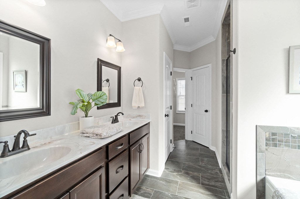 a bathroom with a sink and a mirror and a shower