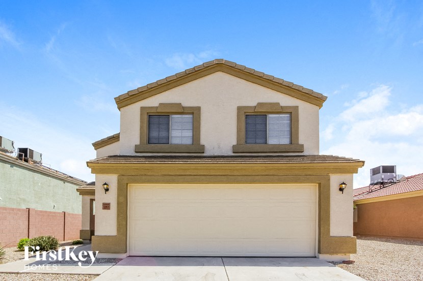 a single story home with a garage door