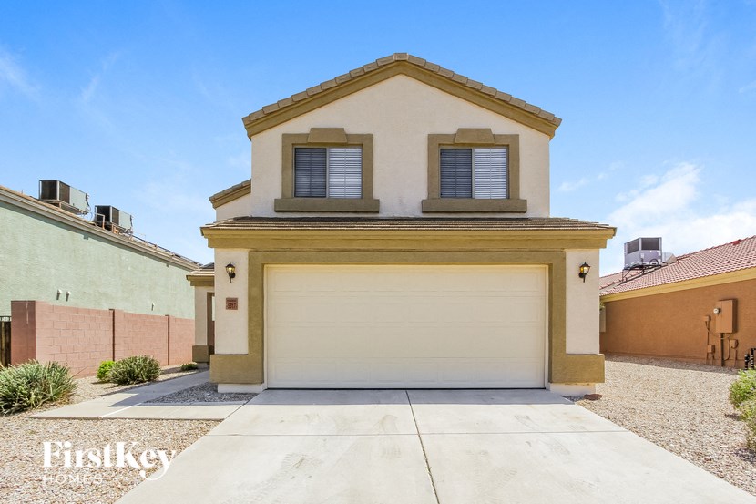 a home with a garage door in front of it