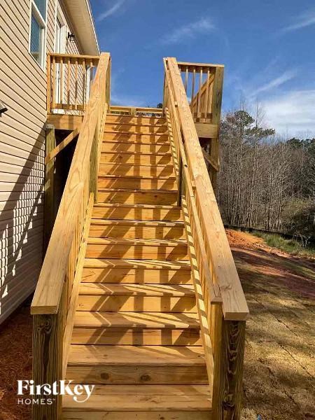 a wooden staircase on the side of a house