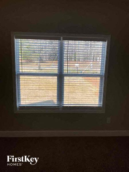 a window in a room with blinds on it