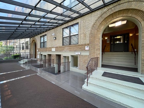 A building with a glass roof and brick walls.