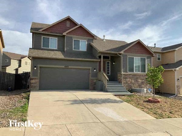 a house with a driveway and a garage door