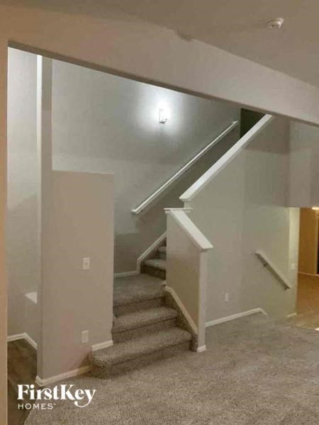 a staircase in a house with a carpeted floor