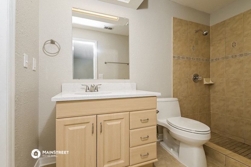 a bathroom with a sink toilet and a shower