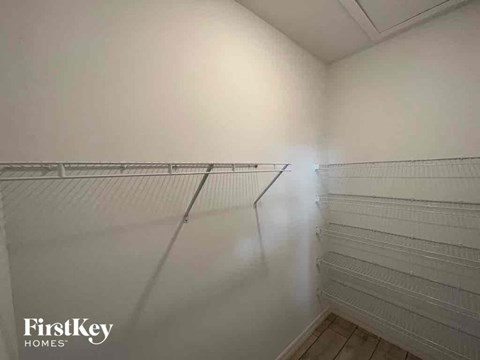 the walk in closet in the master bedroom