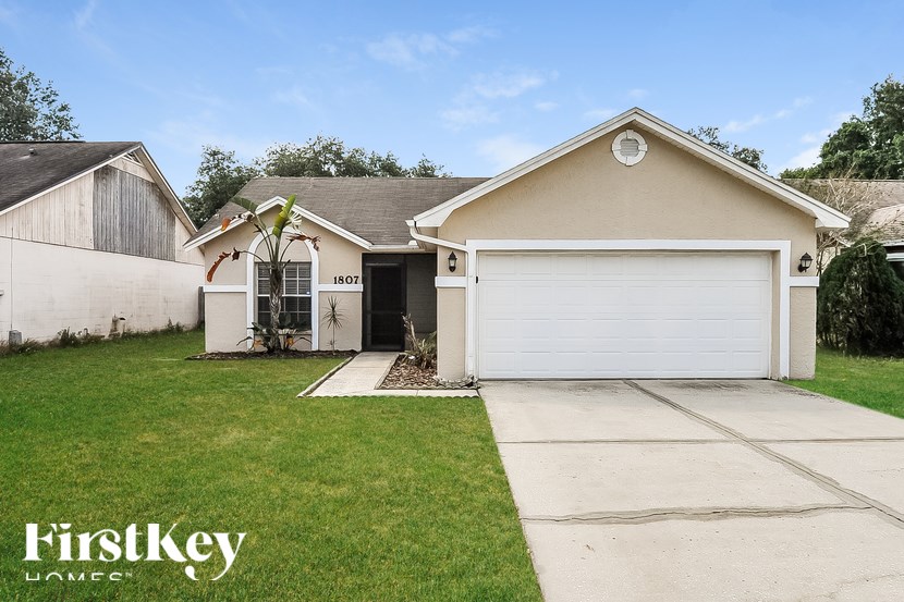 A house with a garage is for sale by FirstKey Homes.