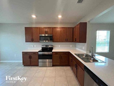 a kitchen with a sink and a stove