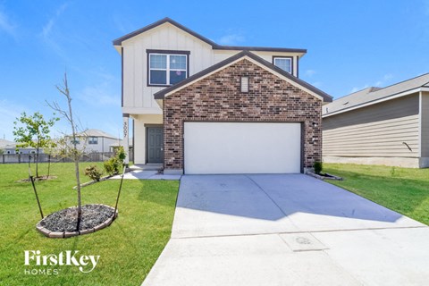a white garage door in front of a house