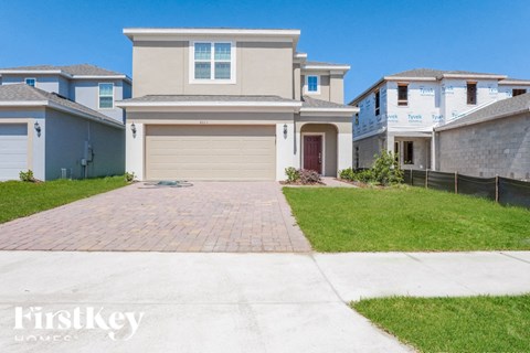 a house with a driveway and a garage door