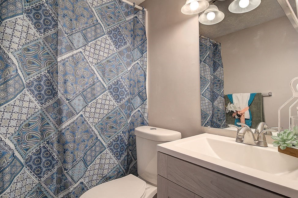 a bathroom with a toilet and a sink