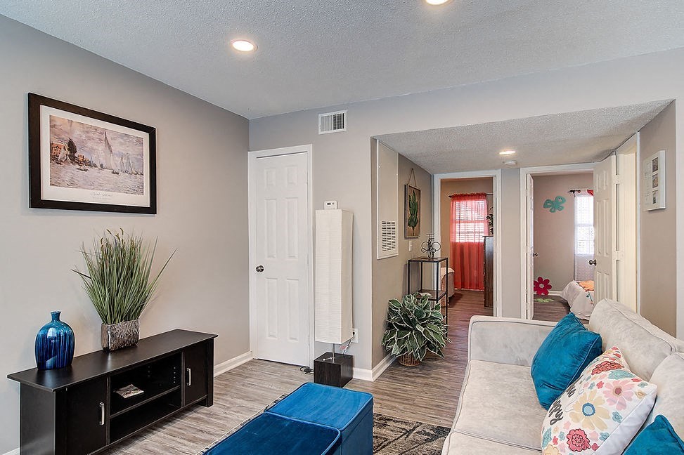 a living room with a couch and a table