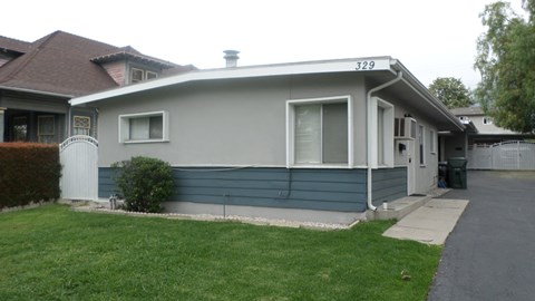 A house with the number 329 on the top of it.