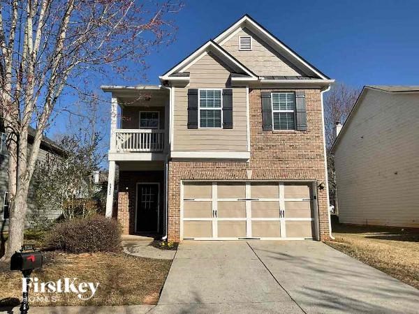 a two story house with a garage door