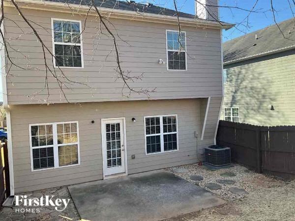 a white house with a patio in front of it