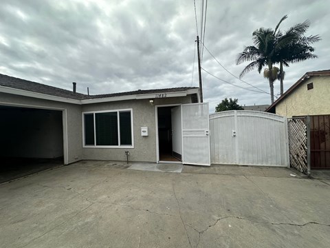 A house with a garage and a fence.