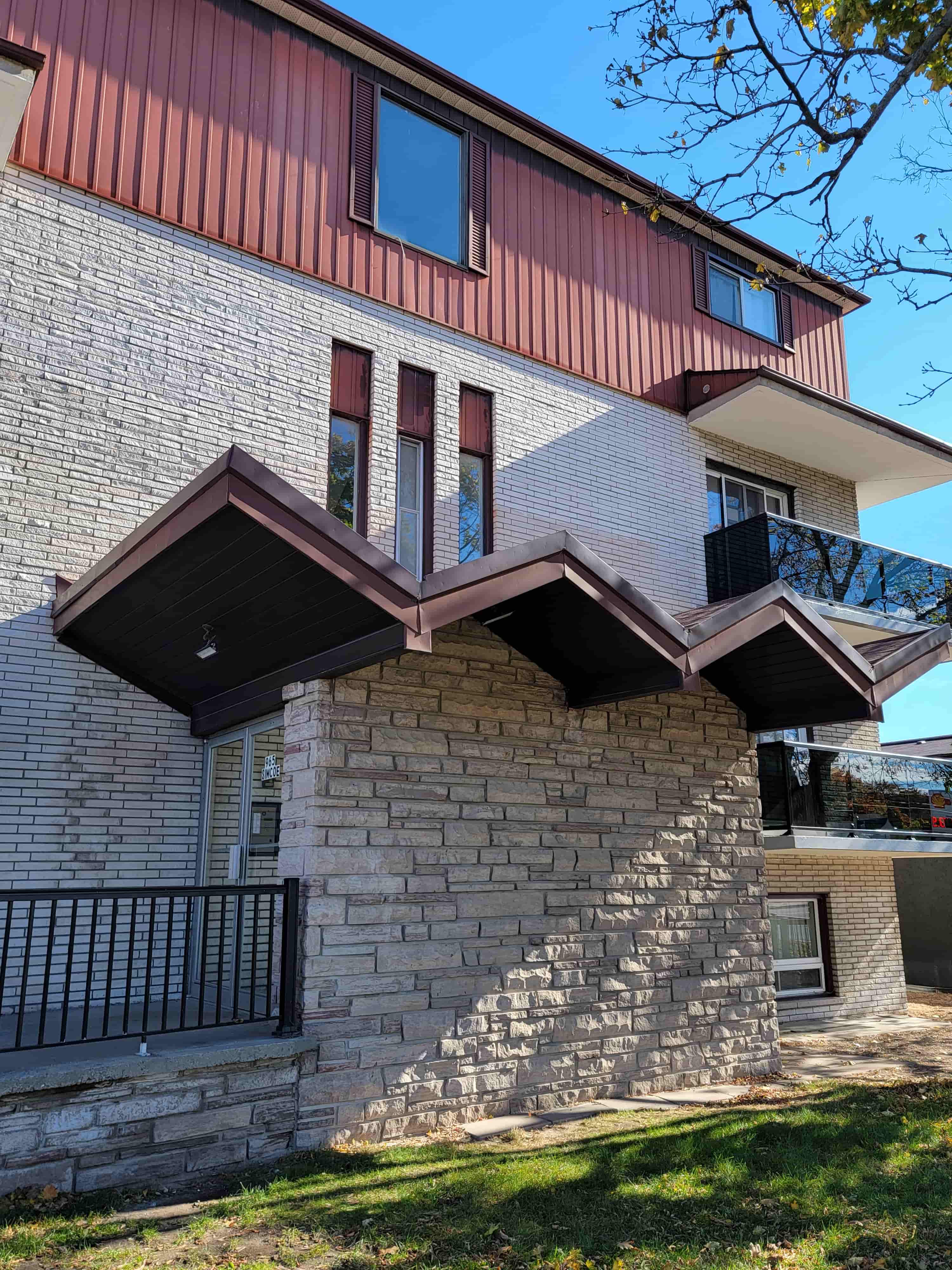 A house with a red roof and a balcony.