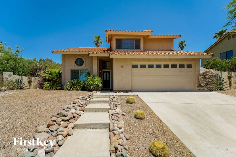 a house with a driveway and a garage door
