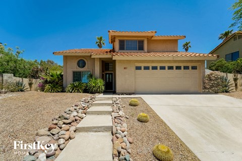 a house with a driveway and a garage door