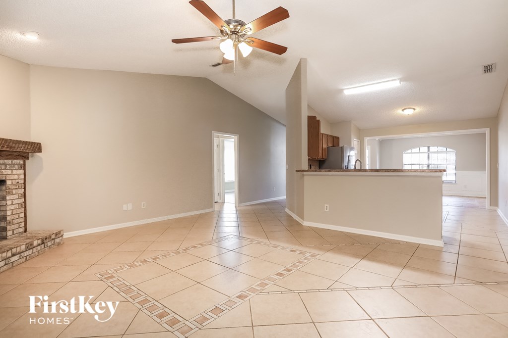 the living room is open to the dining room and kitchen