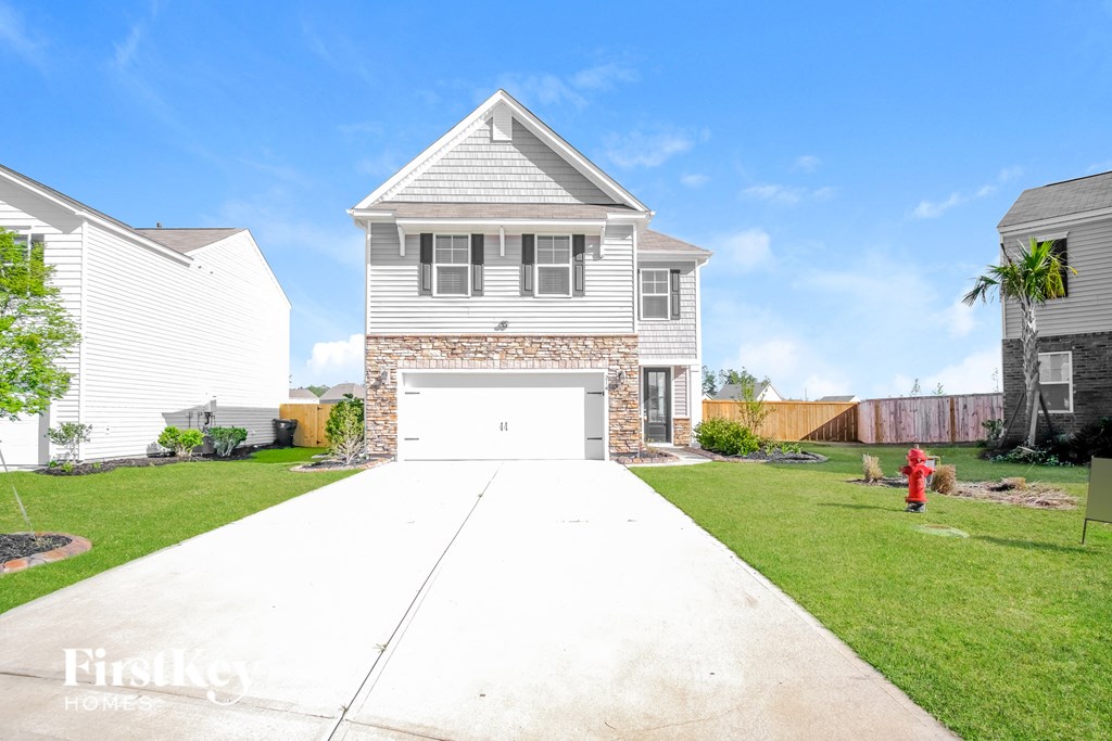 A house with a garage is for sale.