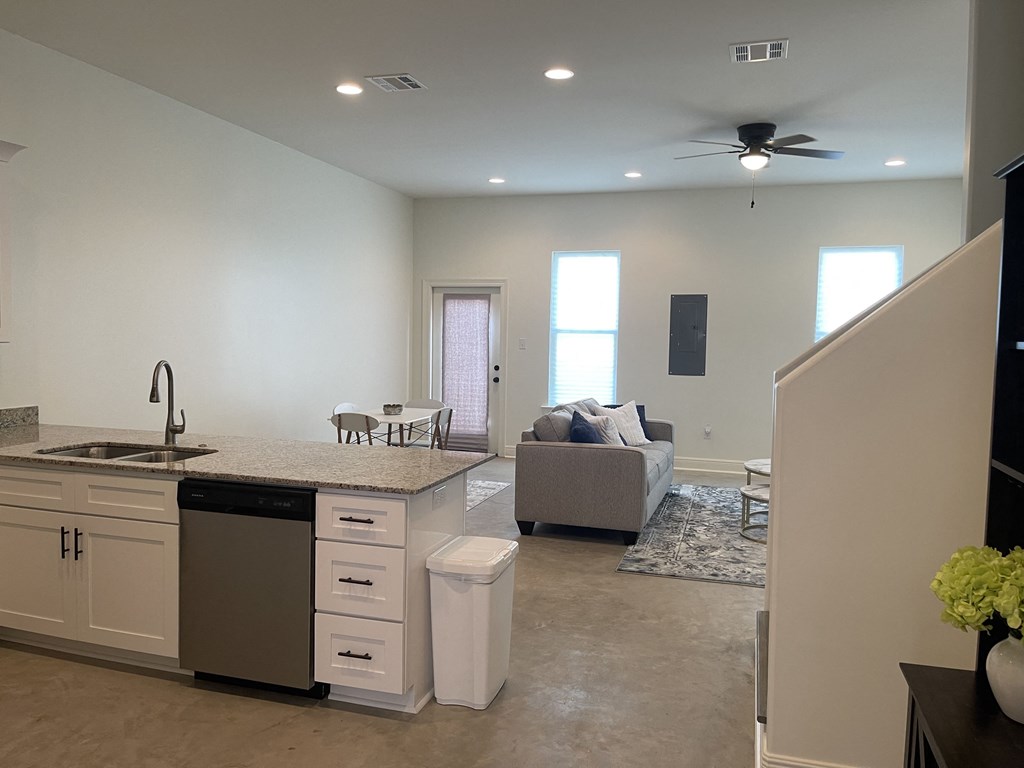 a view from the kitchen into the living room