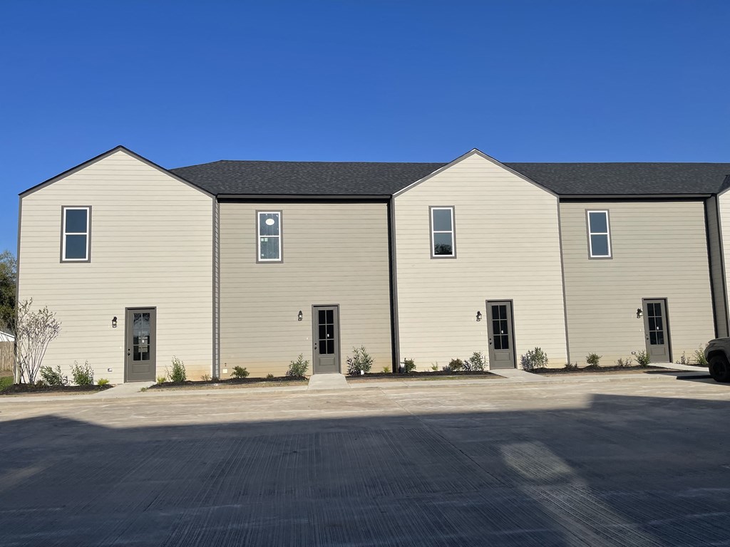 a large building with a street in front of it