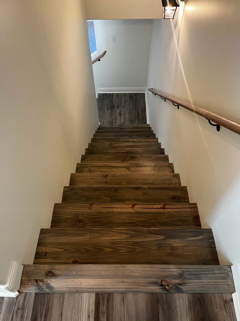 stairs to the 2nd floor with wood flooring