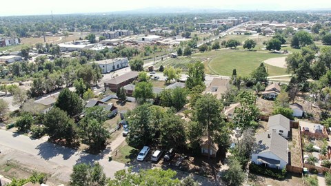 an aerial view of a neighborhood with houses and trees