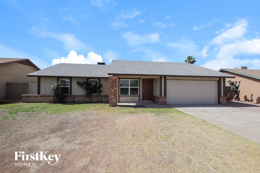 a house with a driveway and a garage door