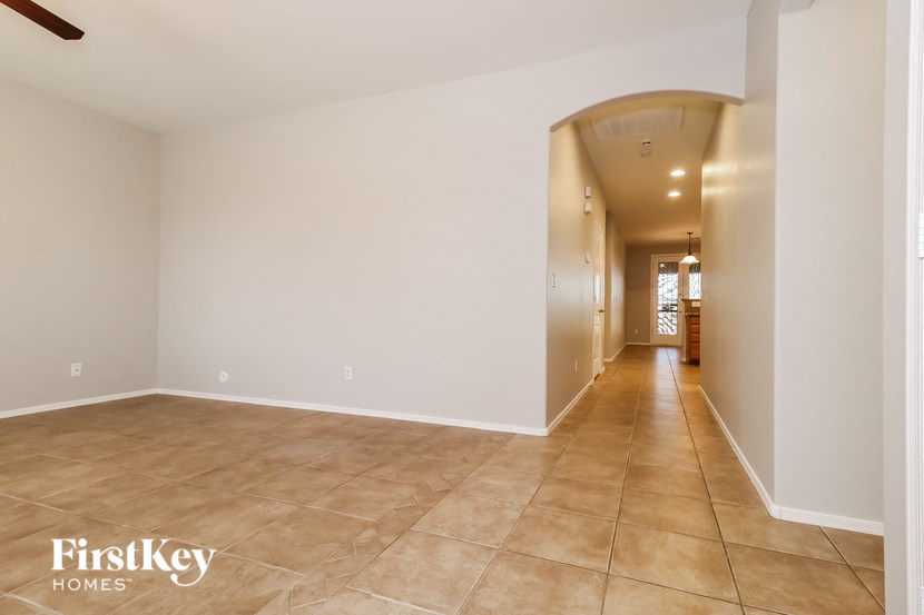 the living room and hallway to the dining room and kitchen