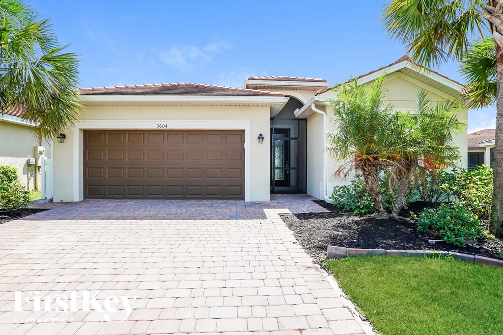 a house with a garage door and a driveway