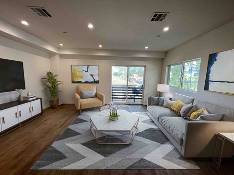 a large living room with a couch and a table