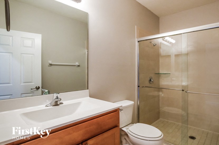 a bathroom with a sink toilet and a shower