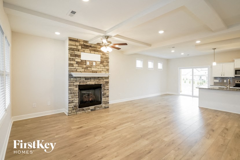 the living room is open to the kitchen and family room