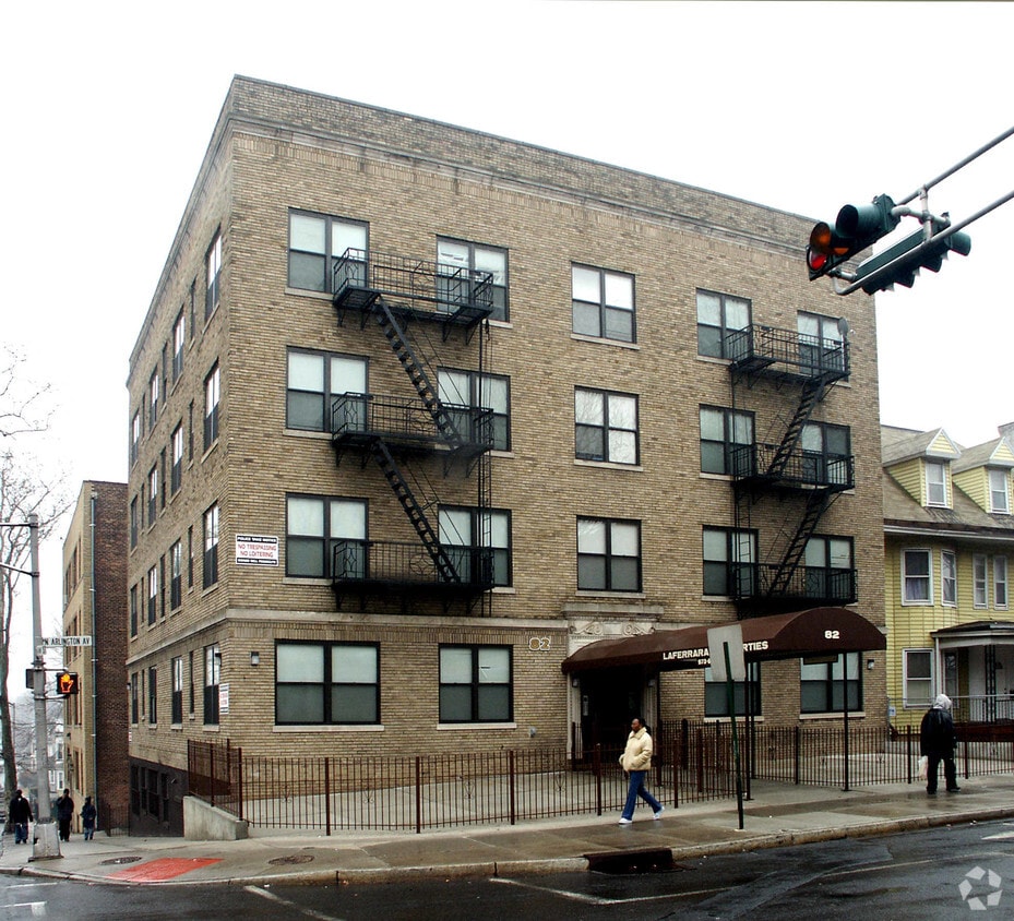 A large brick building with a fire escape on the side.