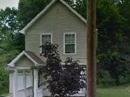 A house with a white door and a window.