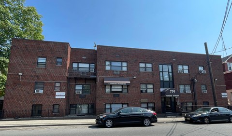 A brick building with the number 774 on it.