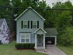 A house with a grey front and a garage.