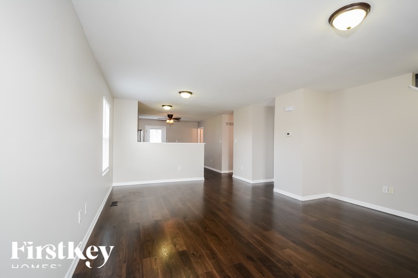 A room with wooden floors and white walls.
