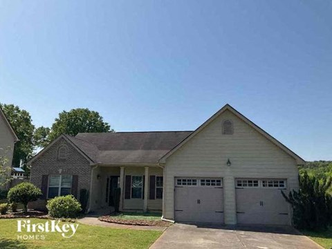 A house with a garage is for sale by FirstKey Homes.