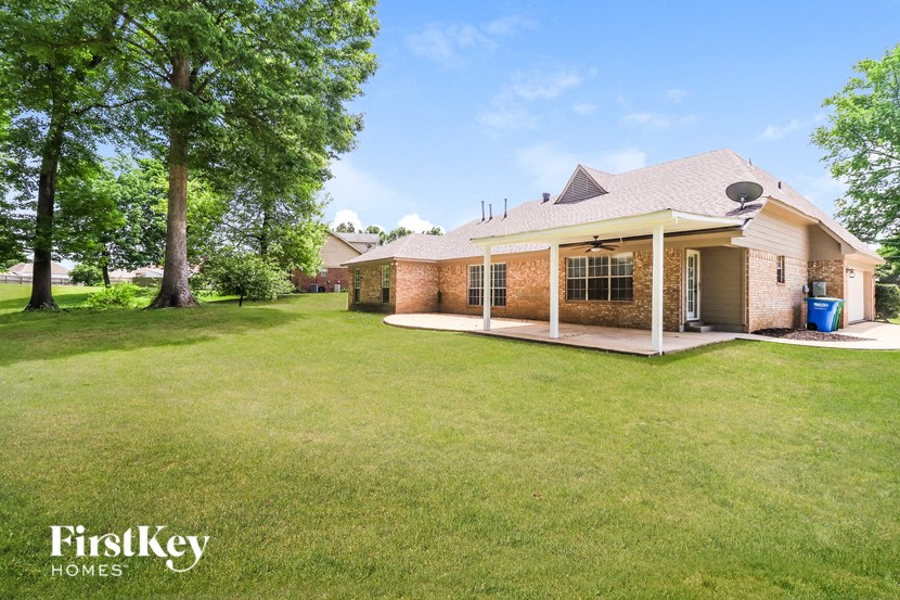 A house with a lawn in front of it.