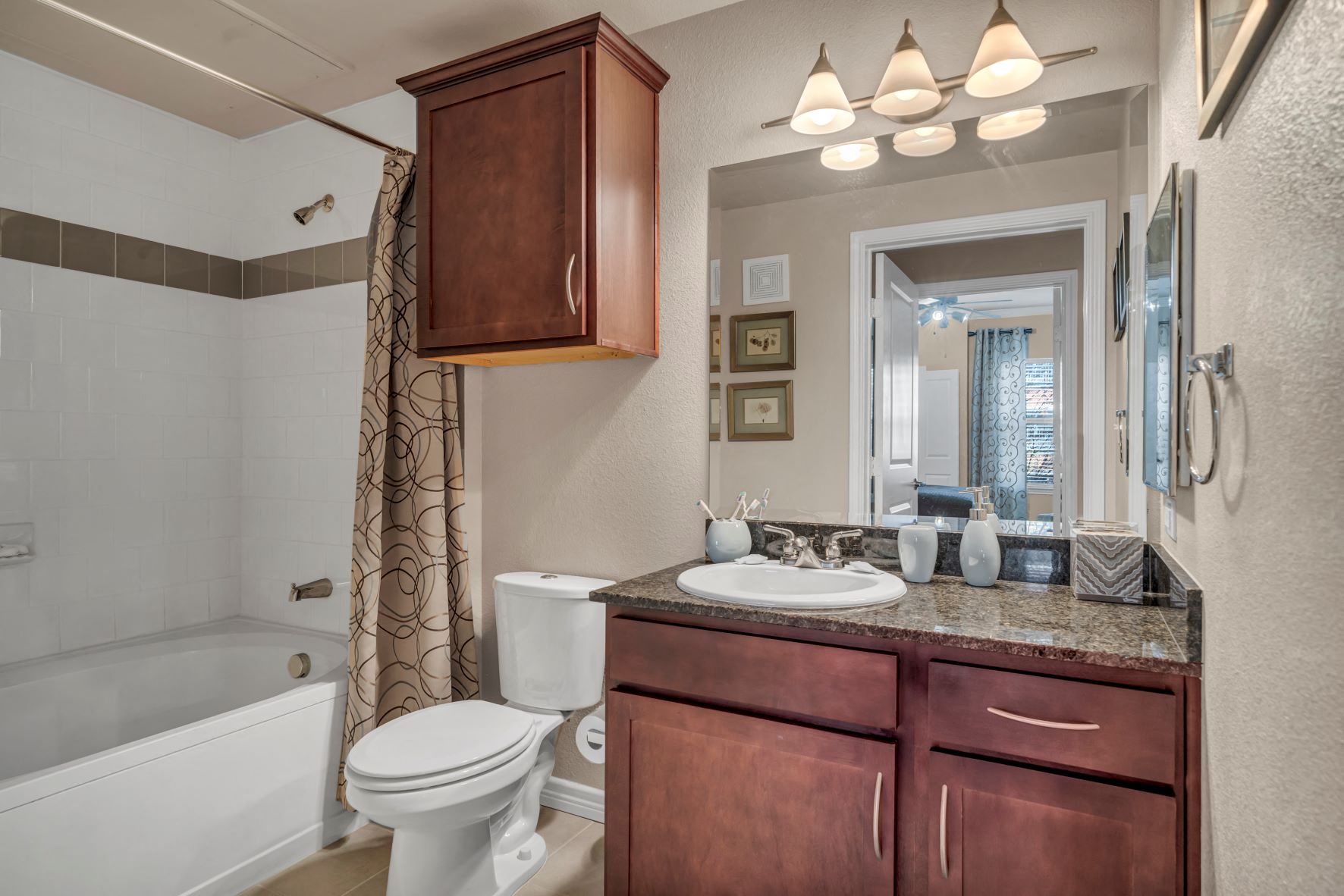 a bathroom with a sink toilet and a bath tub