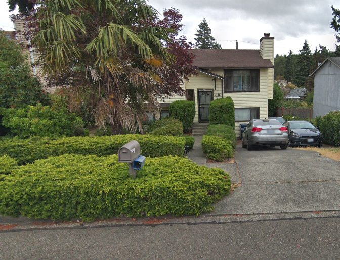a house with cars parked in front of it